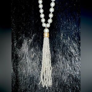 Grey pearl ( costume) necklace with beading and gold and rhinestone detail.